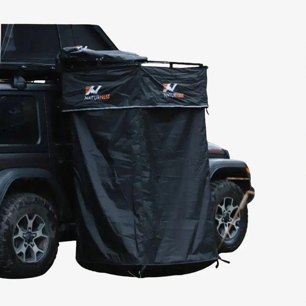 Naturnest outdoor shower room with blacked-out privacy walls and automatic deployment system for 4WD vehicles
