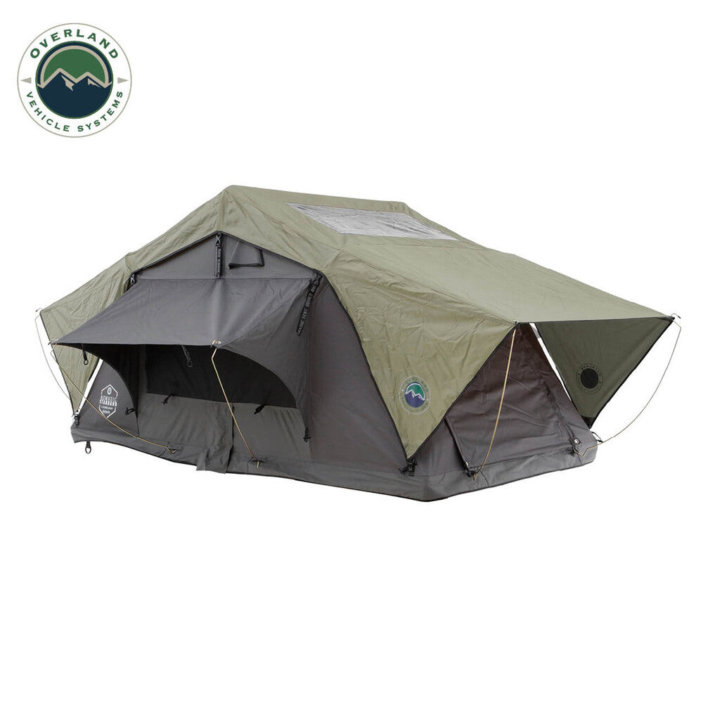 Overland Vehicle Systems Nomadic roof top tent mounted on vehicle with weather-resistant fabric and comfortable interior