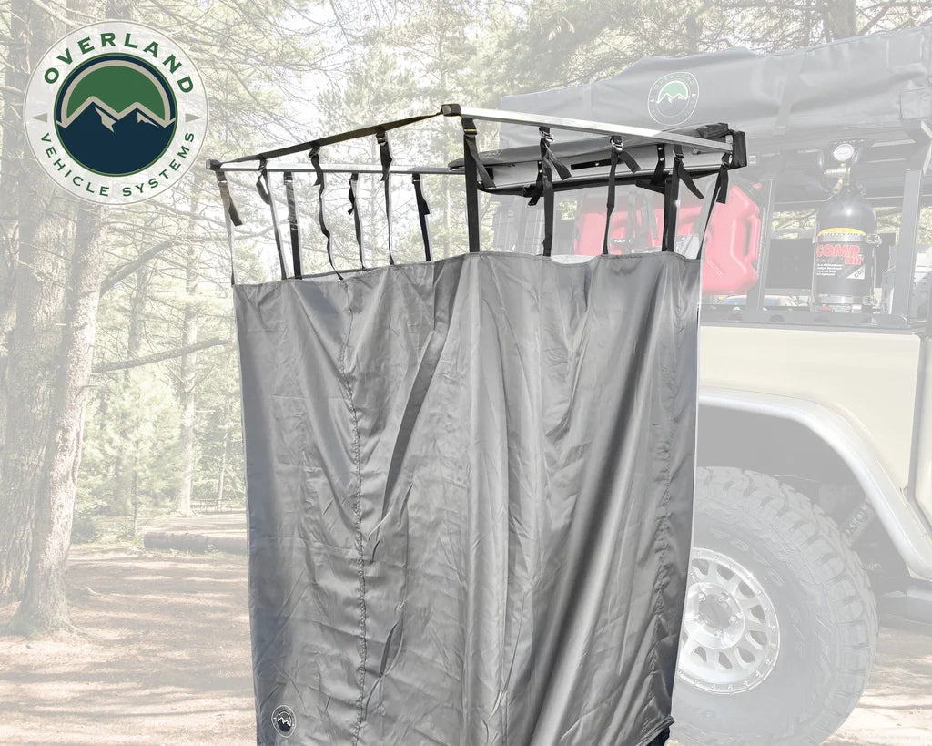 Overland Vehicle Systems HD Nomadic Side Shower Room mounted on vehicle rack with privacy enclosure deployed