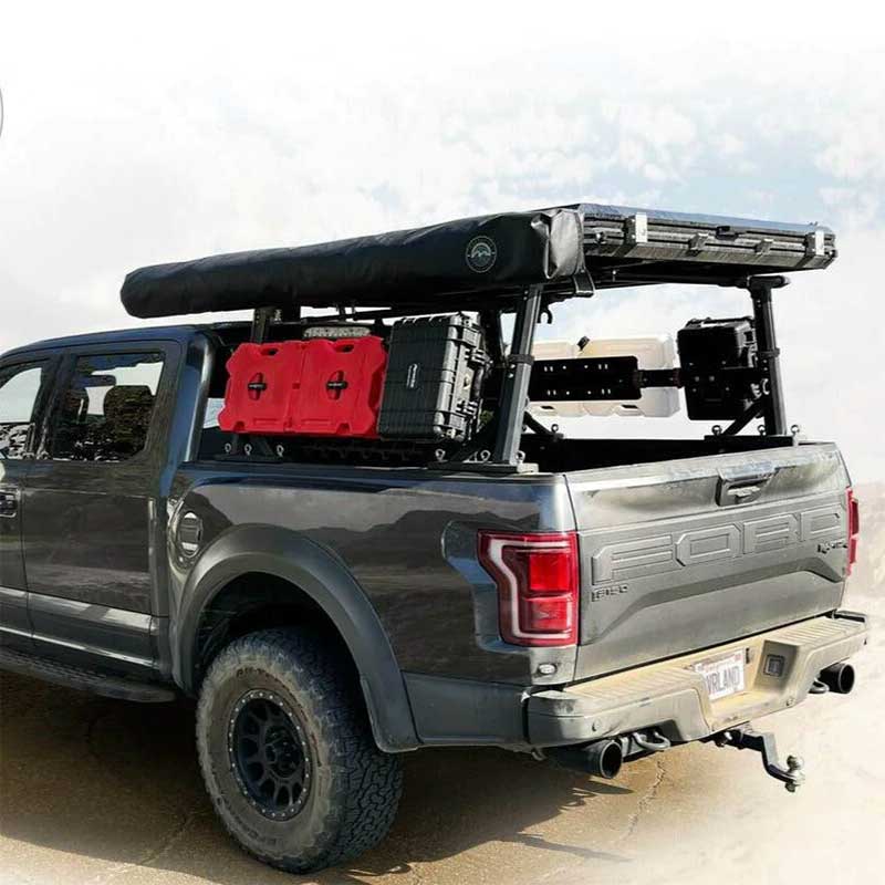 Overland Vehicle Systems Freedom Rack installed on truck bed with cross bars and side supports for cargo mounting