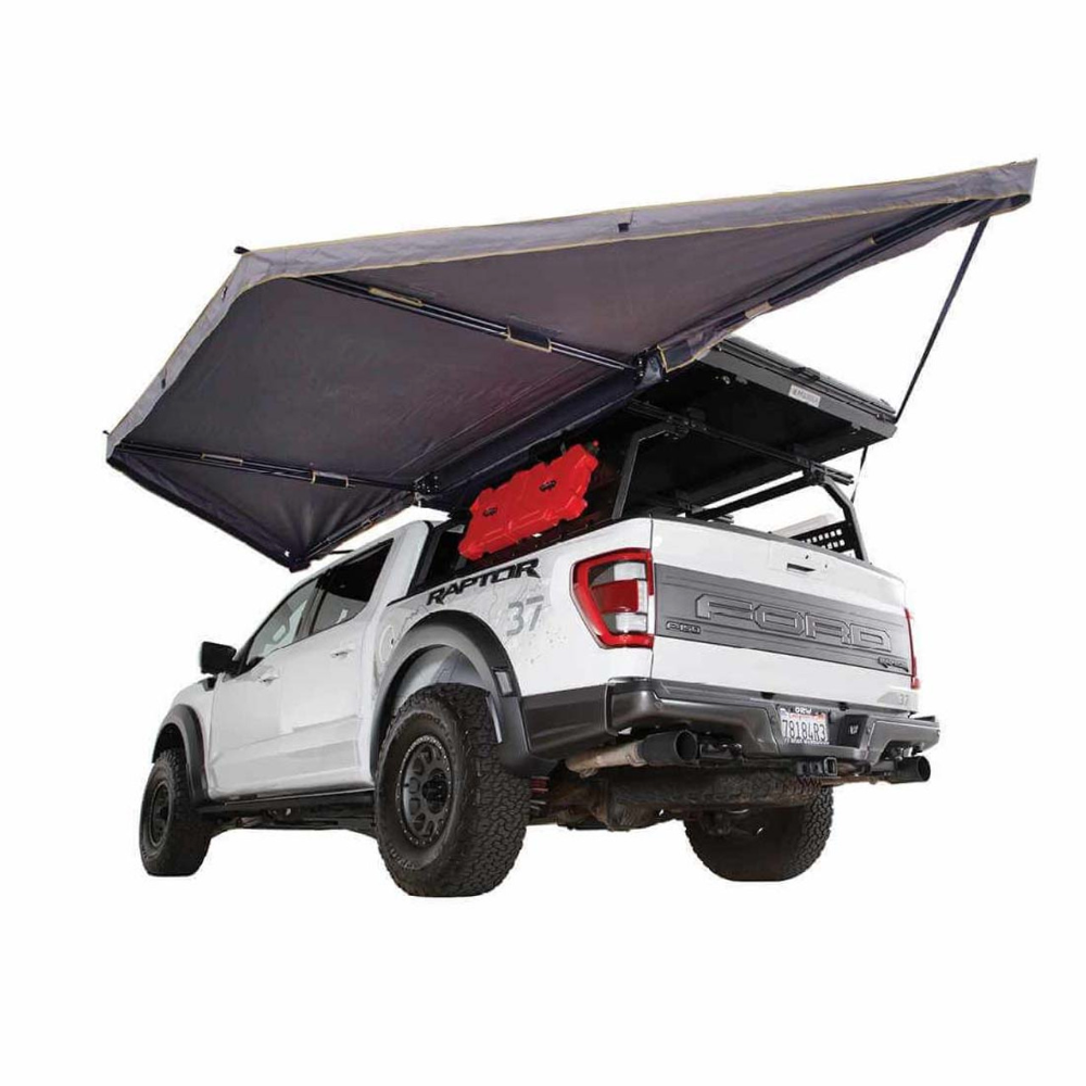 Overland Vehicle Systems Nomadic 180LTE vehicle awning deployed showing full 180-degree coverage with durable fabric and alum
