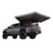 Overland Vehicle Systems Nomadic 270 LTE Awning deployed from vehicle side providing extensive shade coverage