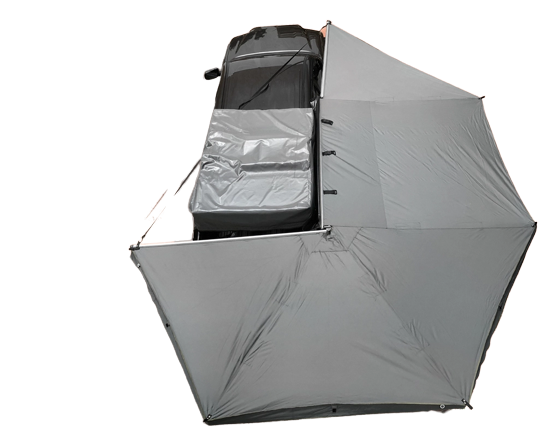 Overland Vehicle Systems 270-degree awning extended from side of van creating large shaded shelter area