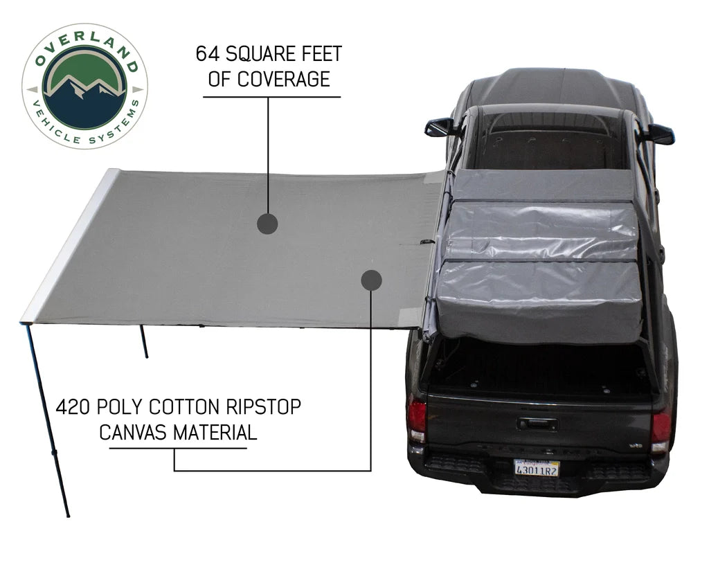 Overland Vehicle Systems Nomadic Side Awning deployed on vehicle side providing shaded outdoor shelter