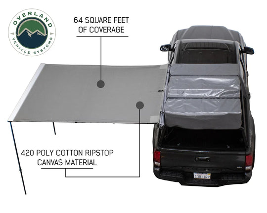 Overland Vehicle Systems Nomadic Side Awning deployed on vehicle side providing shaded outdoor shelter