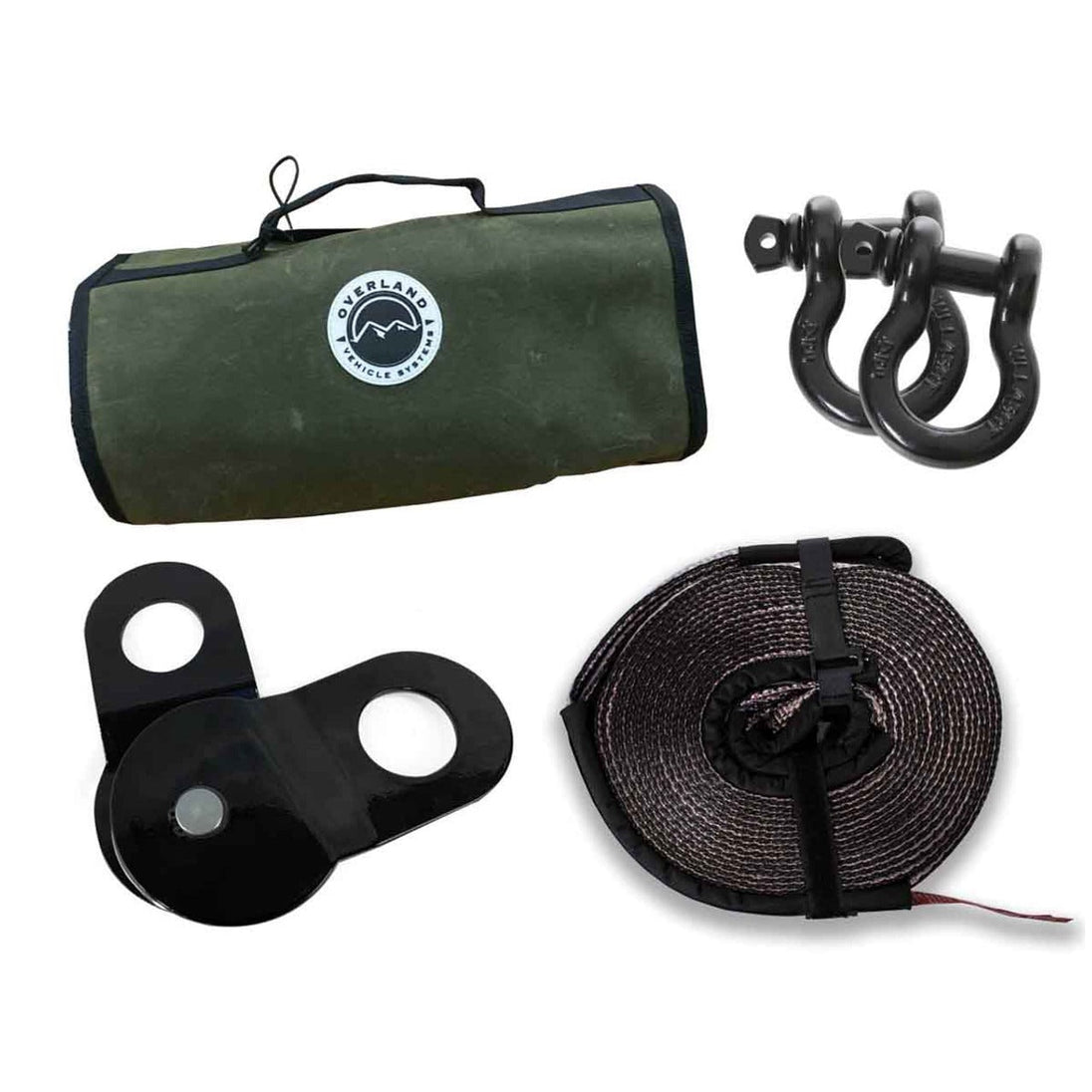 Overland Vehicle Systems Recovery Wrap Combo Kit with heavy-duty straps, shackles, and recovery gear laid out on rugged terra