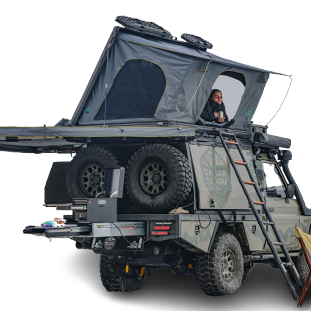 Overland Vehicle Systems Sidewinder aluminum roof top tent deployed on vehicle with side opening