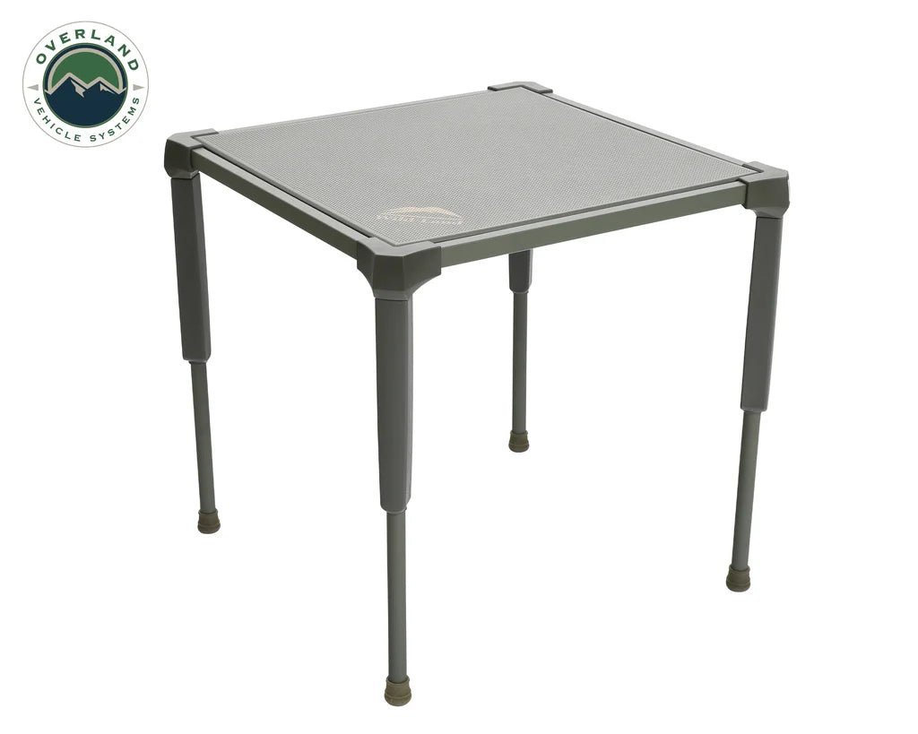 Overland Vehicle Systems compact camping table with anti-slip surface set up in outdoor environment