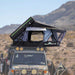 Overland Vehicle Systems Everest cantilever roof top tent mounted on vehicle with ladder extended