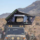 Overland Vehicle Systems Everest cantilever roof top tent mounted on vehicle with ladder extended