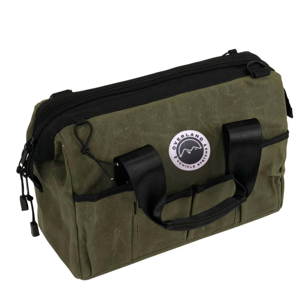 Overland Vehicle Systems waxed canvas tool bag with multiple compartments and leather handles for outdoor gear storage