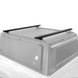 Heavy-duty black aluminum truck cap crossbars mounted on vehicle roof with mounting points for overland gear