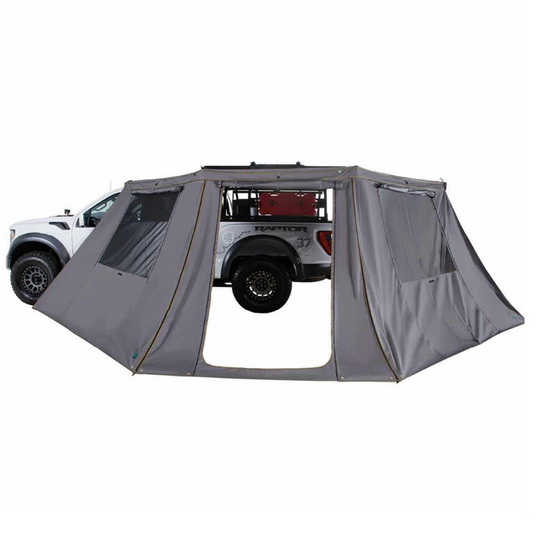 Overland Vehicle Systems Nomadic Awning Wall attached to vehicle with mesh windows and durable fabric construction
