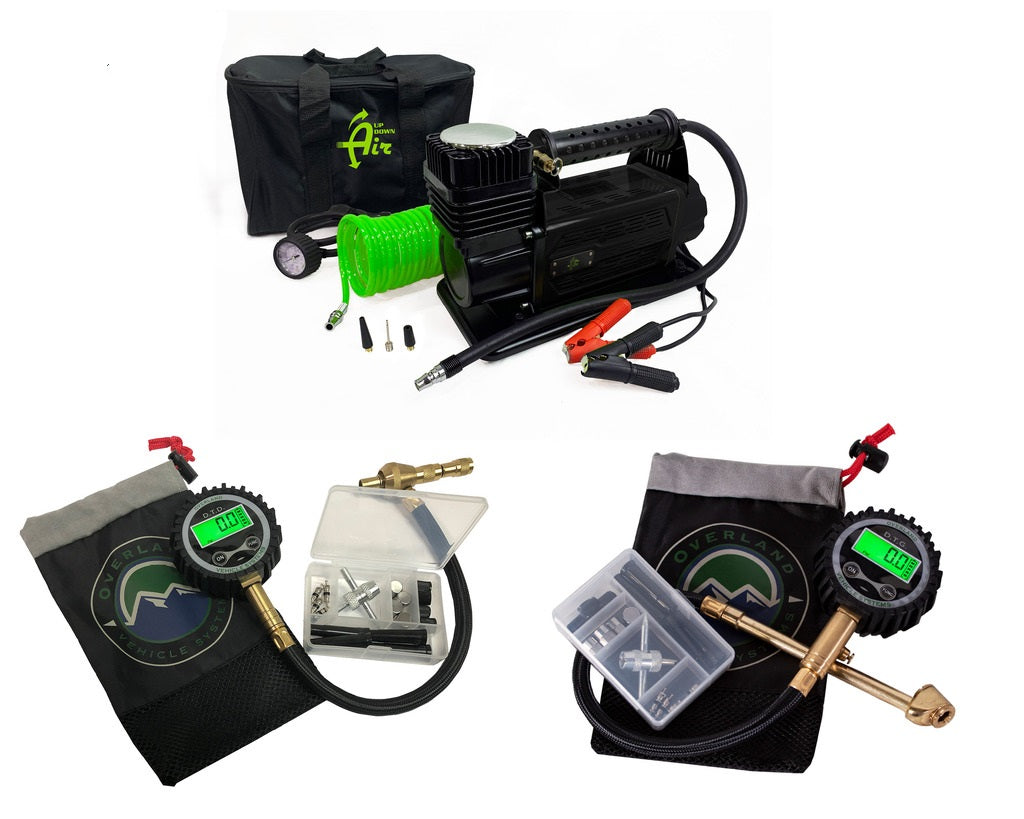 Overland Vehicle Systems portable air compressor and tire deflator kit with digital gauge on rugged terrain