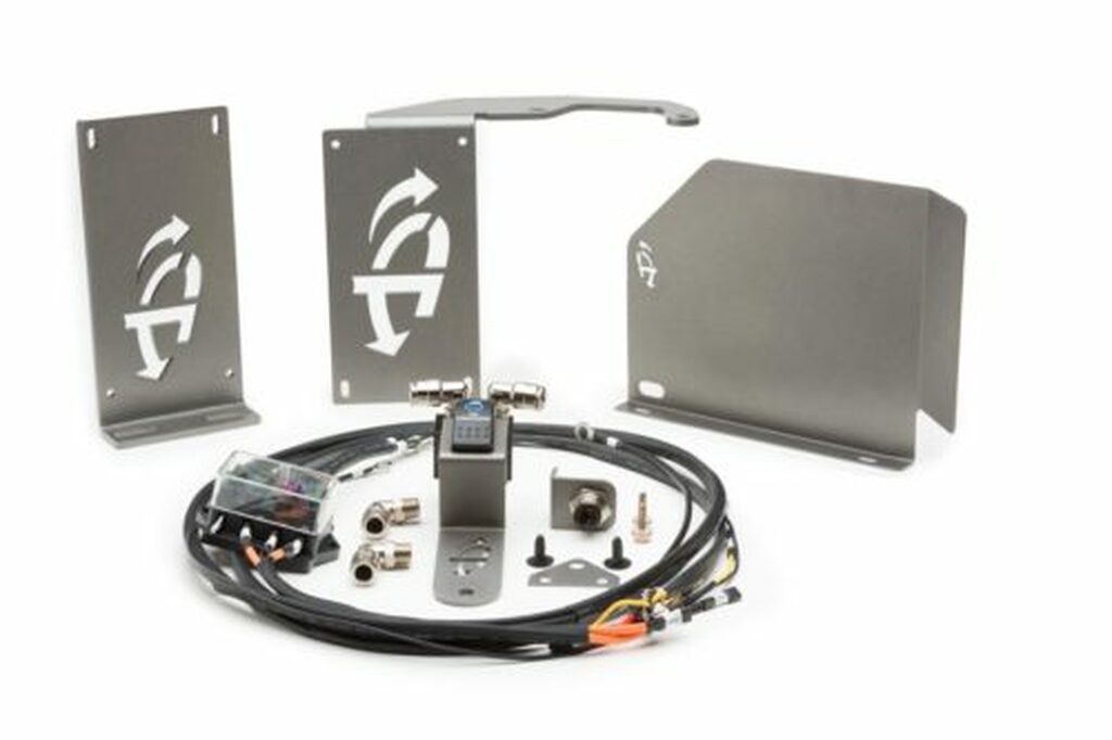 Overland Vehicle Systems Up Down Air compressor mounting bracket kit installed in vehicle