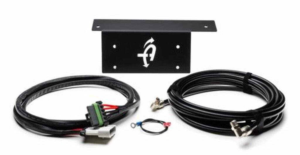 Overland Vehicle Systems air compressor bracket kit installed in Jeep JK/JL showing secure mounting hardware and professional