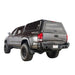 Overland Vehicle Systems Expedition Truck Cap with full wing doors open showing spacious truck bed storage area