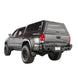 Overland Vehicle Systems Expedition Truck Cap with full wing doors open showing spacious truck bed storage area