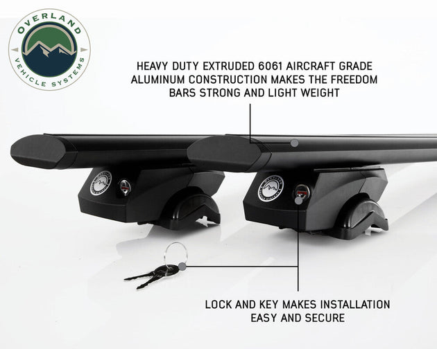 Overland Vehicle Systems Freedom Cross Bars mounted on vehicle roof rails with adventure gear attachment points