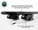 Overland Vehicle Systems Freedom Cross Bars mounted on vehicle roof rails with adventure gear attachment points