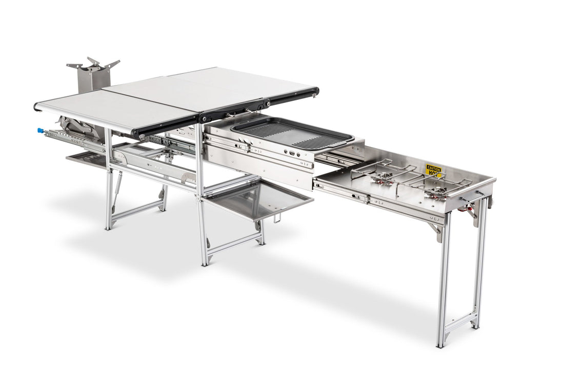 Overland Vehicle Systems Komodo Camp Kitchen setup with cooking surface, storage compartments, and foldable design for outdoo
