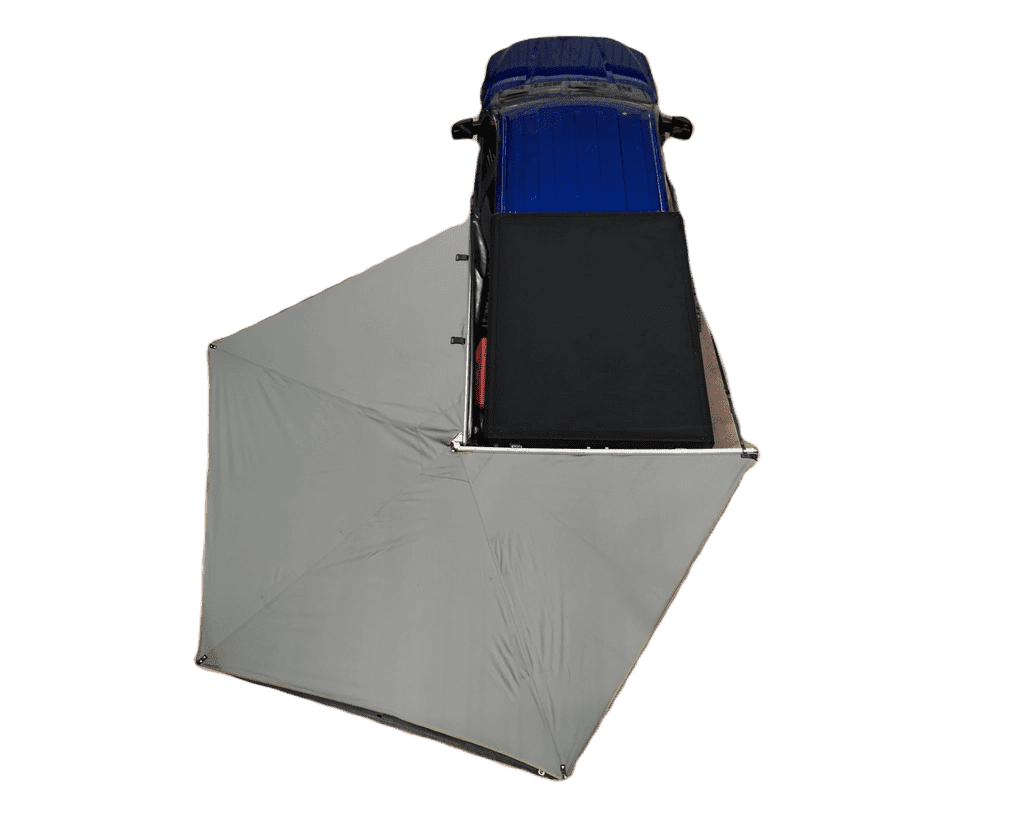 Black Overland Vehicle Systems Lite 270-degree awning extended from SUV creating shaded outdoor living space
