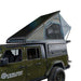Overland Vehicle Systems MagPak camper shell tent combo installed on pickup truck with rooftop tent deployed