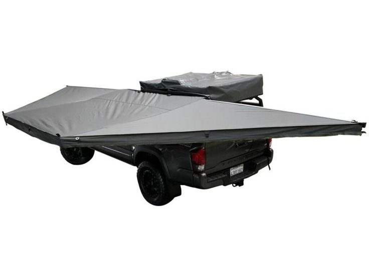Overland Vehicle Systems Nomadic 180 Awning deployed on vehicle providing large shaded outdoor living space