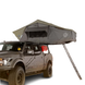 Overland Vehicle Systems Nomadic 4 Extended rooftop tent mounted on vehicle with spacious sleeping area open