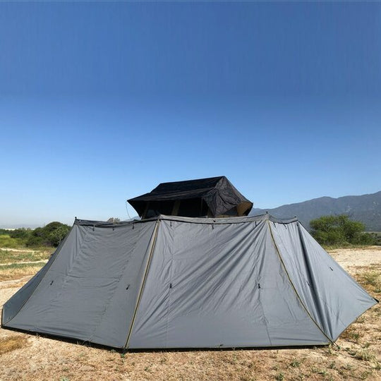 Overland Vehicle Systems HD Nomadic 270 Side Wall attached to vehicle awning providing full 270-degree weather protection