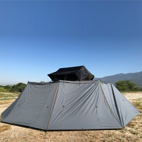 Overland Vehicle Systems HD Nomadic 270 Side Wall attached to vehicle awning providing full 270-degree weather protection