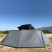 Overland Vehicle Systems HD Nomadic 270 Side Wall attached to vehicle awning providing full 270-degree weather protection