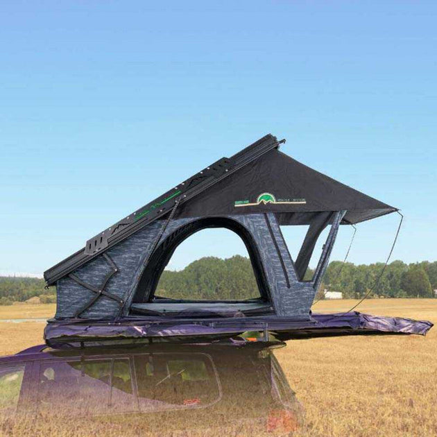 Overland Vehicle Systems Lhotse clamshell roof top tent mounted on vehicle with aluminum shell and ladder extended