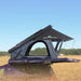 Overland Vehicle Systems Lhotse clamshell roof top tent mounted on vehicle with aluminum shell and ladder extended
